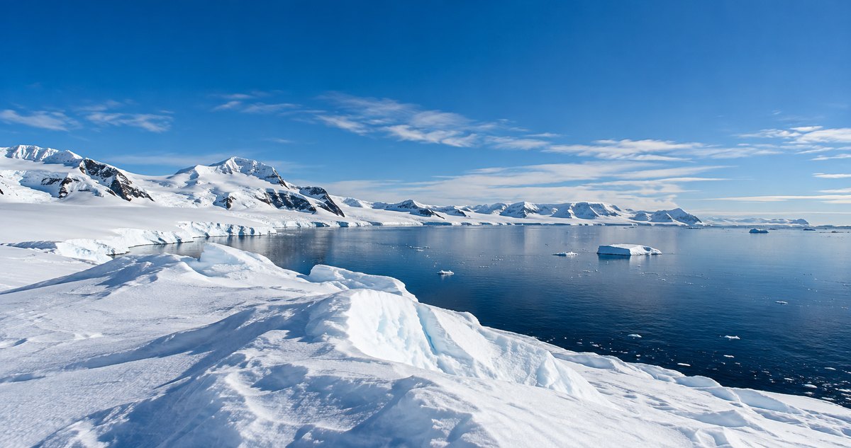 AI-generated representative Antarctic ice coastline under a clear blue sky